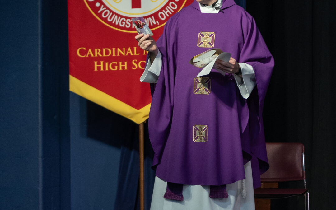 Cardinal Mooney takes part in CRS Rice Bowl program